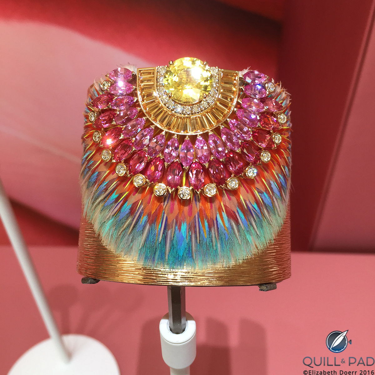 One-of-a-kind Piaget cuff’s unique feather marquetry crowned by an exquisite non-heat-treated yellow sapphire framed by baguette-cut spessartites and marquise-cut pink sapphires