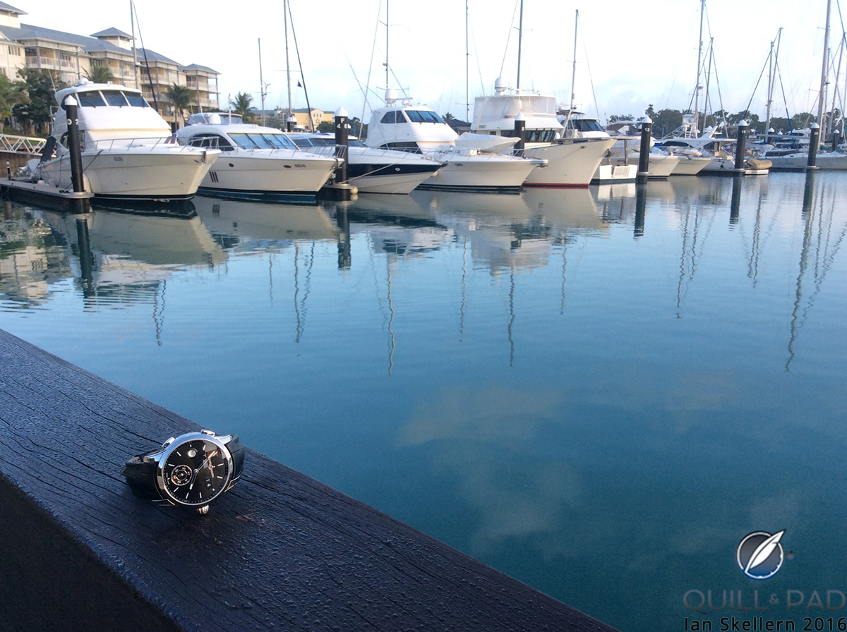 Ulysse Nardin Dual Time sitting by a dock in the bay at Airlie Beach
