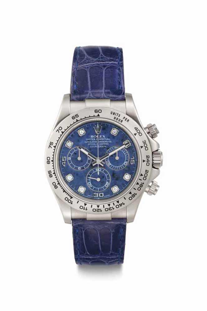 Lot 70: Rolex. A Fine 18k White Gold Automatic Chronograph Wristwatch with Center Seconds and Sodalite Dial.